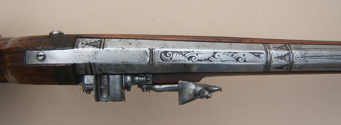 A HIGH QUALITY & UNUSUAL AUSTRIAN-HUNGARIAN/EASTERN EUROPEN (RUSSIAN?) 17TH CENTURY WHEELOCK SPORTING CARBINE w/ RELIEF CARVED & SILVER INLAYED STOCK, dtd. 1674 view 4