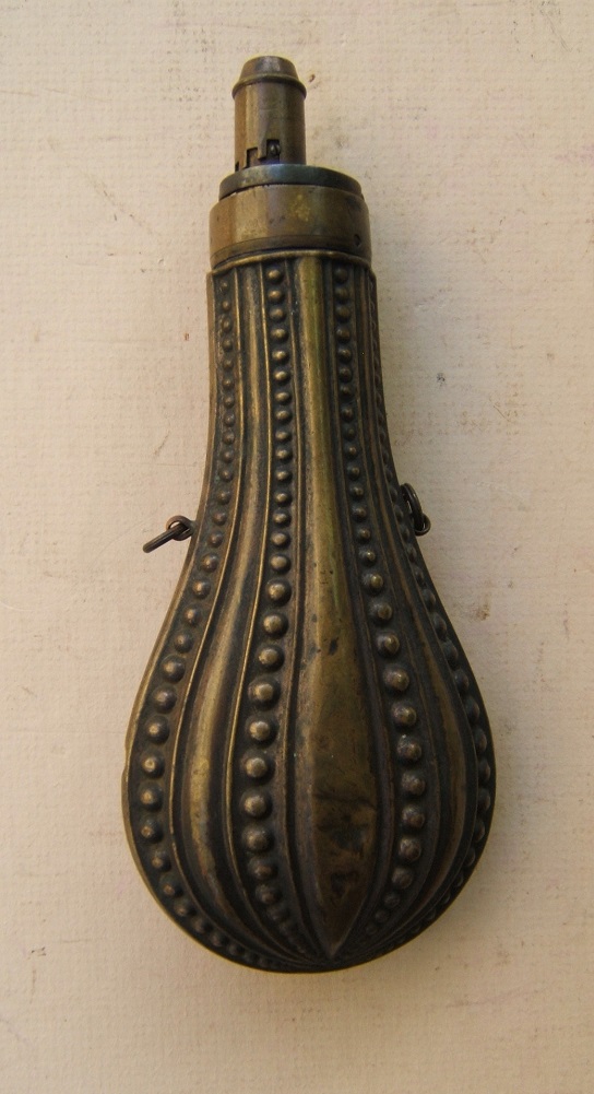 A VERY GOOD Mid-19th CENTURY EMBOSSED COPPER-ALLOY/BRASS POWDER FLASK, ca. 1850 view 1