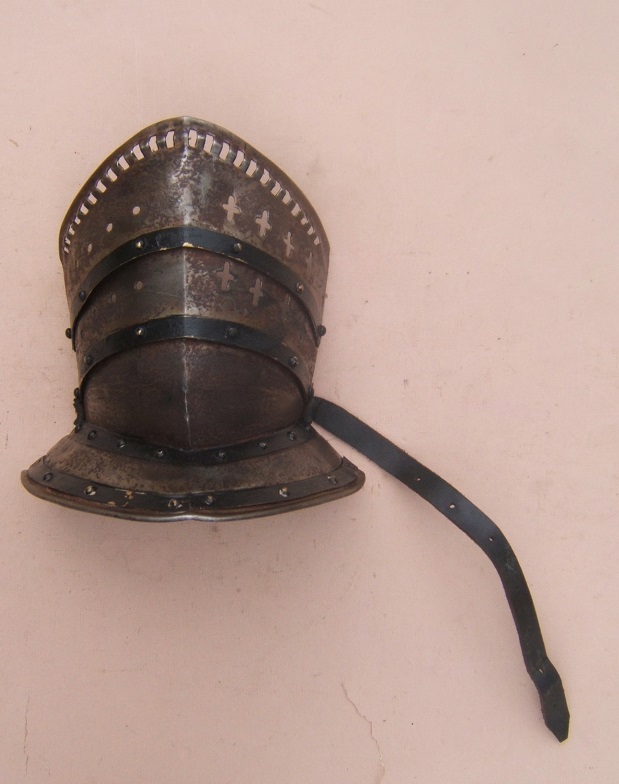 A VERY GOOD VICTORIAN PERIOD PIERCED-STEEL BEVOR (FACE-DEFENSE) TO A CLOSED-HELMET, ca. 1900 front