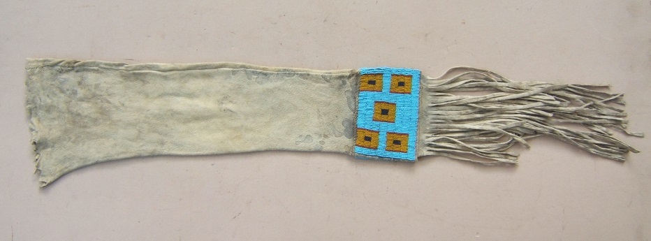 A FINE TRADE-BEAD DECORATED MID-19TH CENTURY AMERICAN PLAINS INDIAN (SIOUX) BUFFALO HIDE PIPE-BAG, ca. 1870 view1