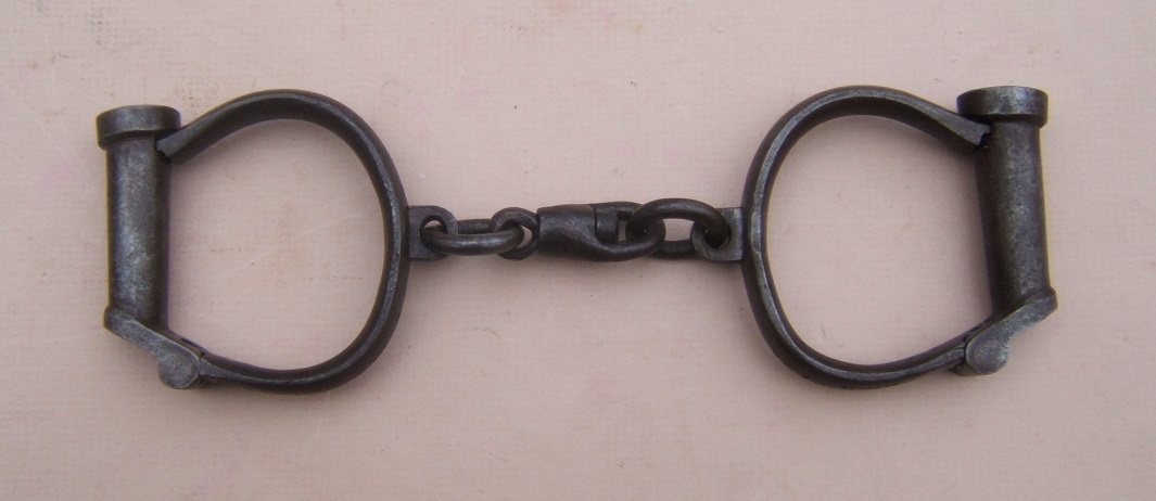 A FINE PAIR OF 19TH CENTURY/CIVIL WAR ERA HANDCUFFS, by 