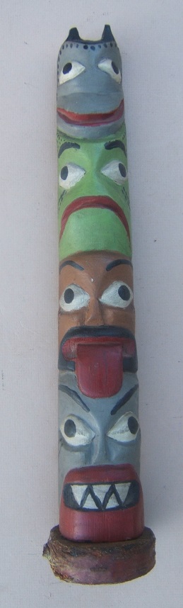 AN EARLY 20TH CENTURY PACIFIC NORTH WEST COAST TLINGIT/HAIDA CARVED CEDAR & POLYCHROME PAINTED TOTEM POLE, ca. 1930 view 1